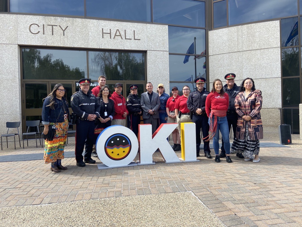 LPS and others with Oki sign at City Hall Census