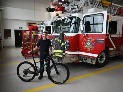 Firefighter-paramedic Patrick Berry with mountain bike at Station #5