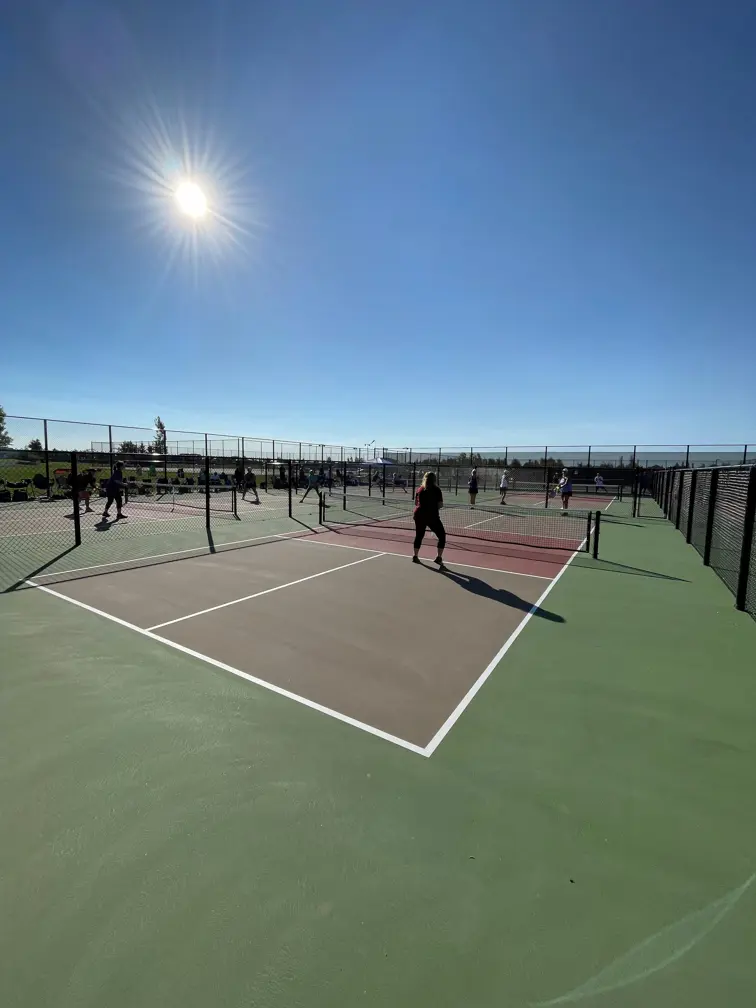 Legacy Pickleball courts sunny people playing pickleball