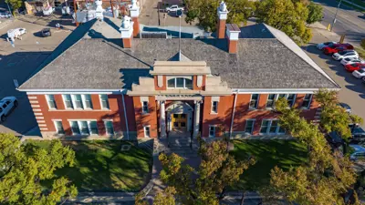 Bowman building drone view- surrounded by green trees