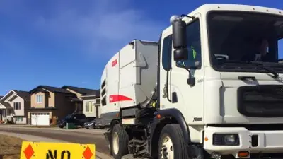 Street sweeper with no parking sign
