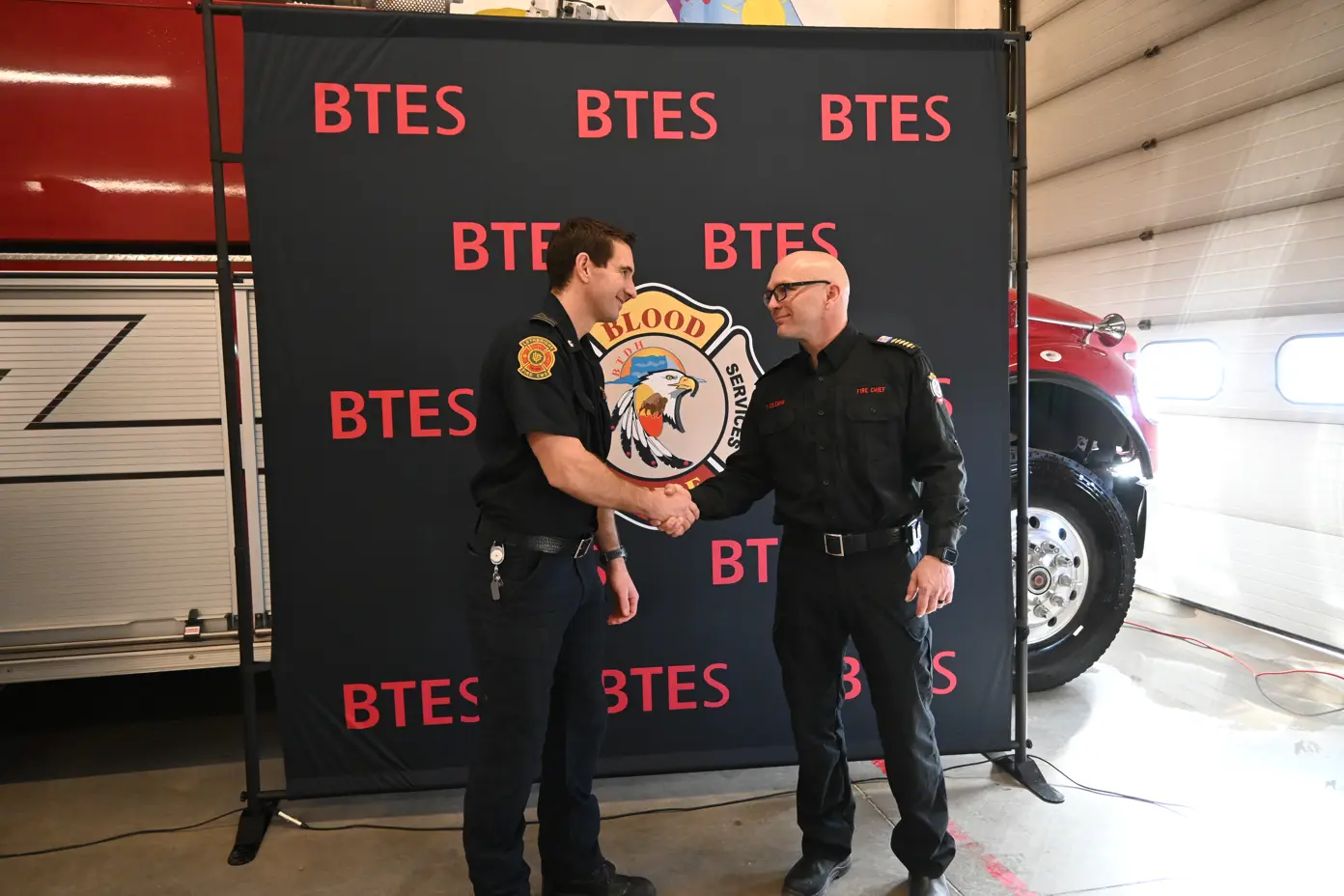 LFES DC McKeown and BT Chief Travis Coleman - shaking hands at announcement of fire dispatch - February 24, 2025