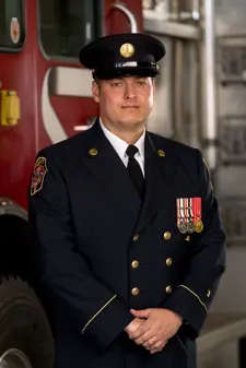 Troy Hicks Chief Fire Marshal 2024 in uniform Infront of truck