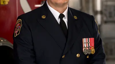 Troy Hicks Chief Fire Marshal 2024 in uniform Infront of truck