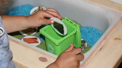 Toddler Oscar sorting organics