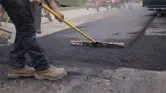 Street Road Paving Worker with Rake